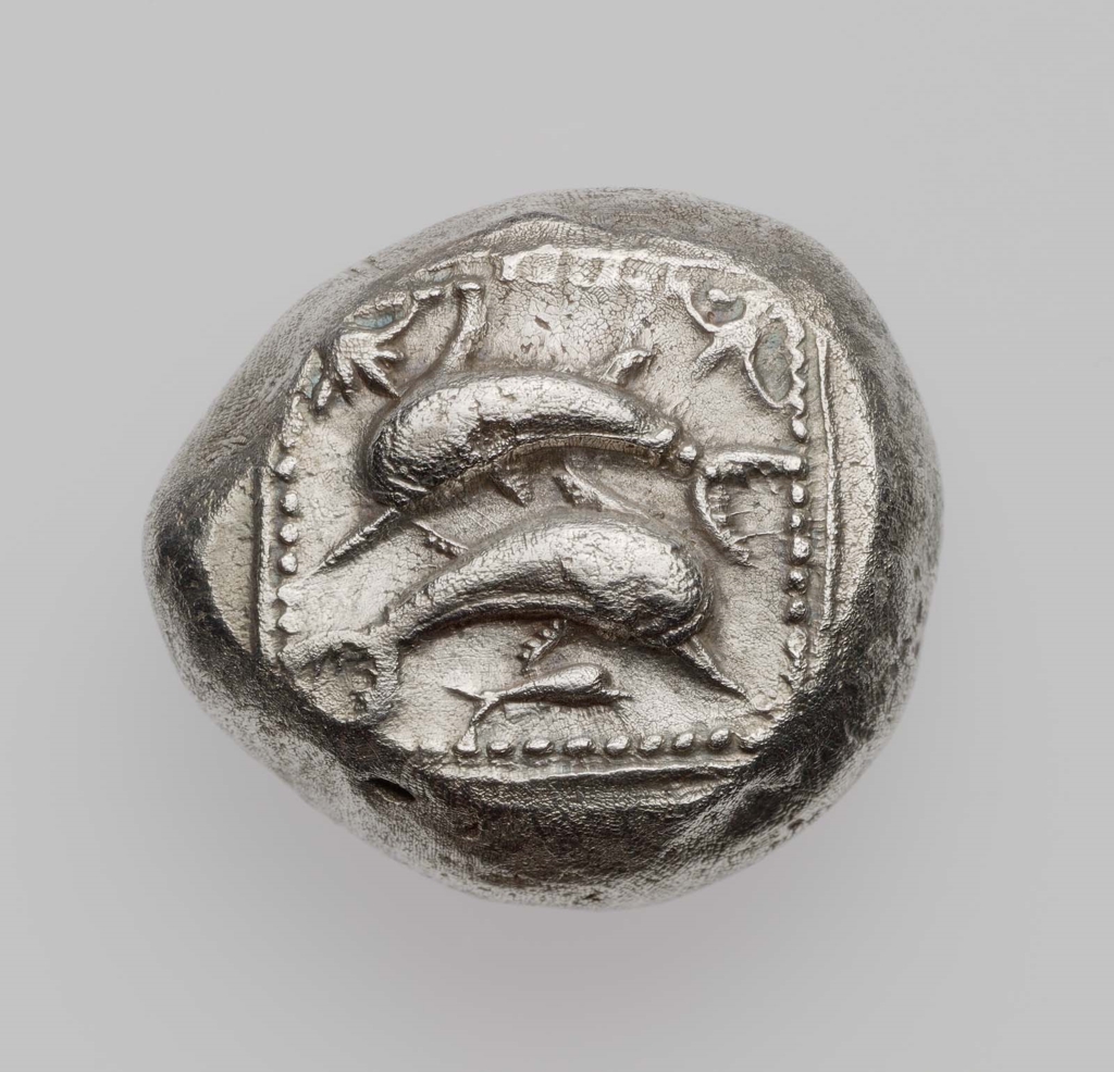 Stater of Poseidion with three dolphins and flower about 500 B.C.