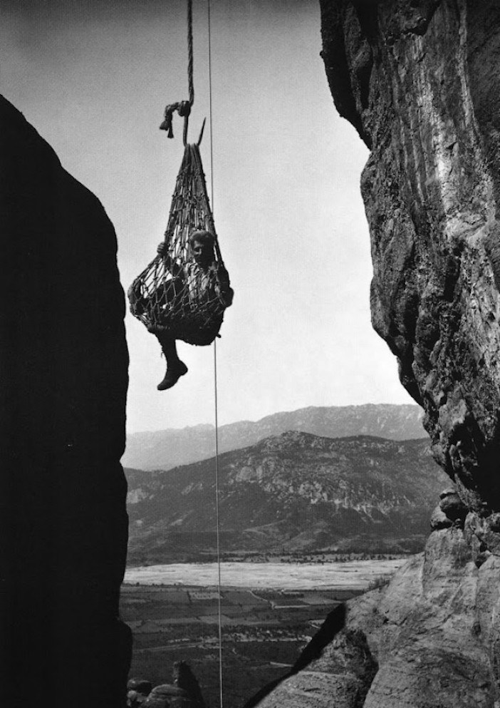 Meteora 1908. The photographer being hoisted up to a monastery.